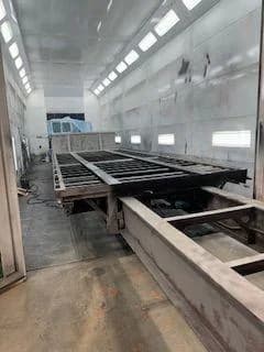 Trailer frame prepped in the booth