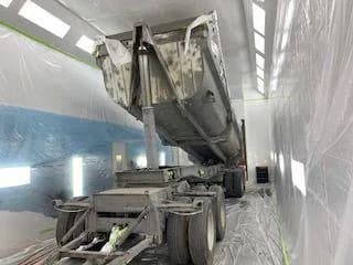 Dump trailer in the spray booth