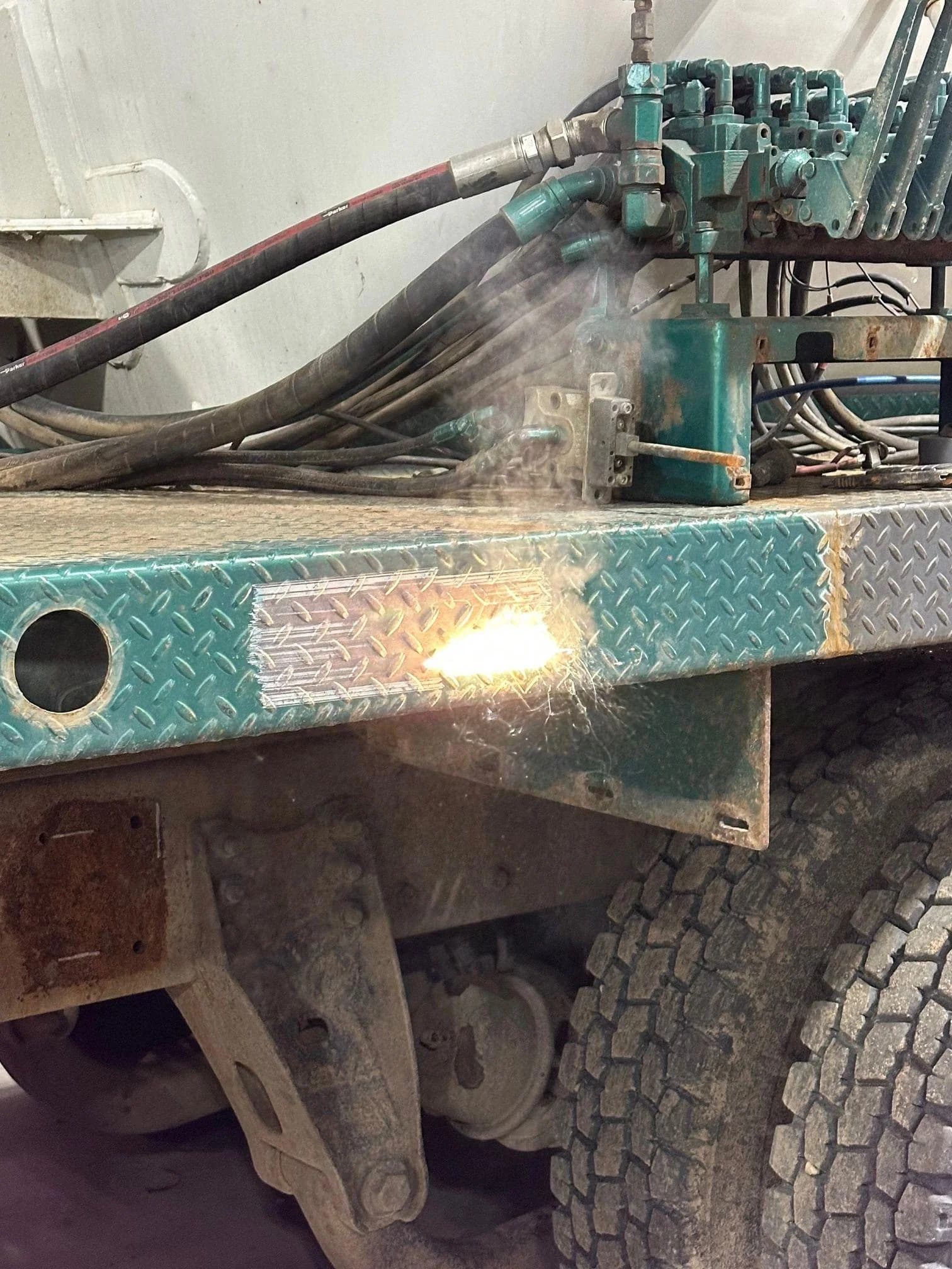 Laser cleaning rust from a trailer frame