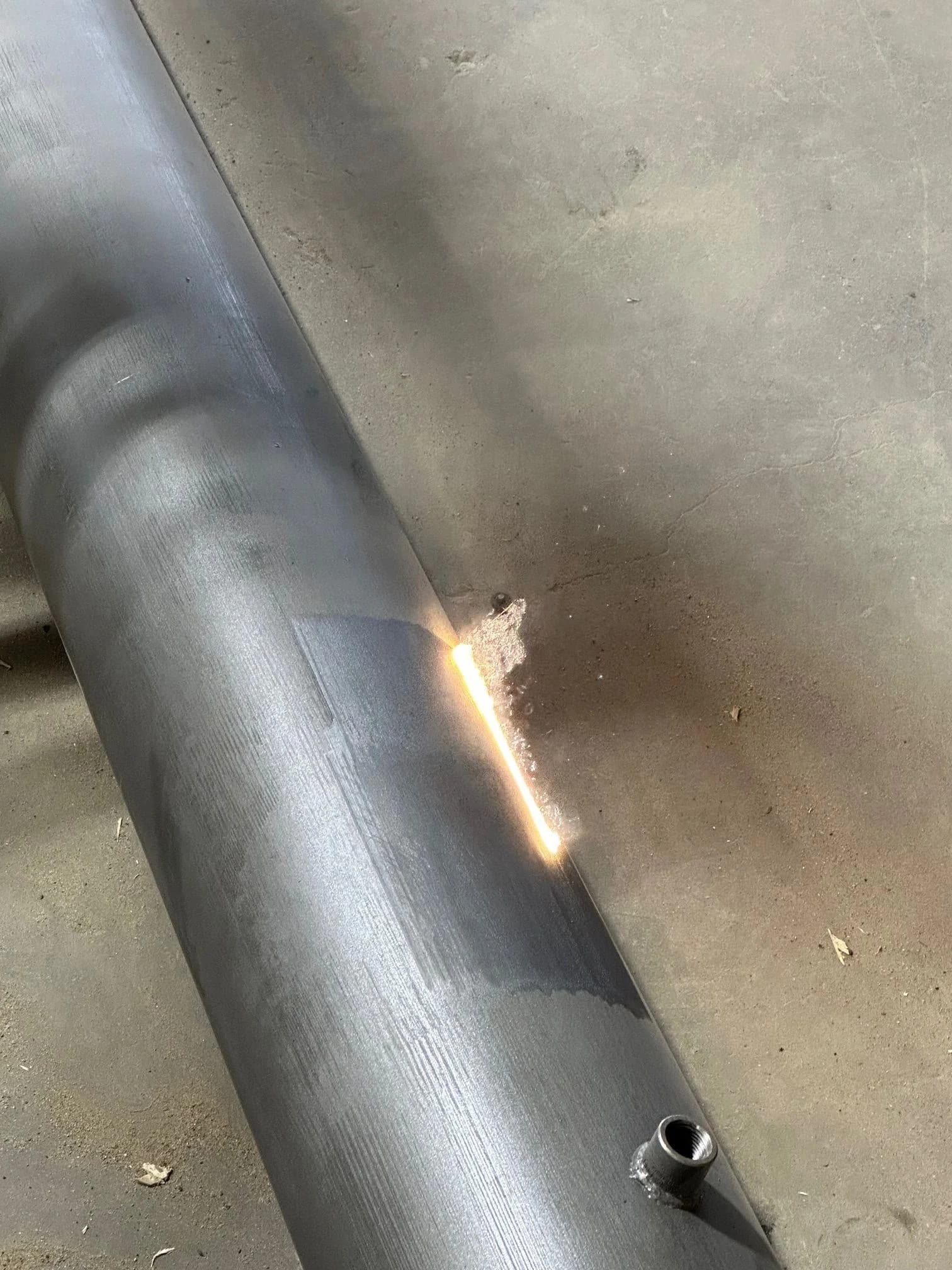 Laser cleaning a steel pipe