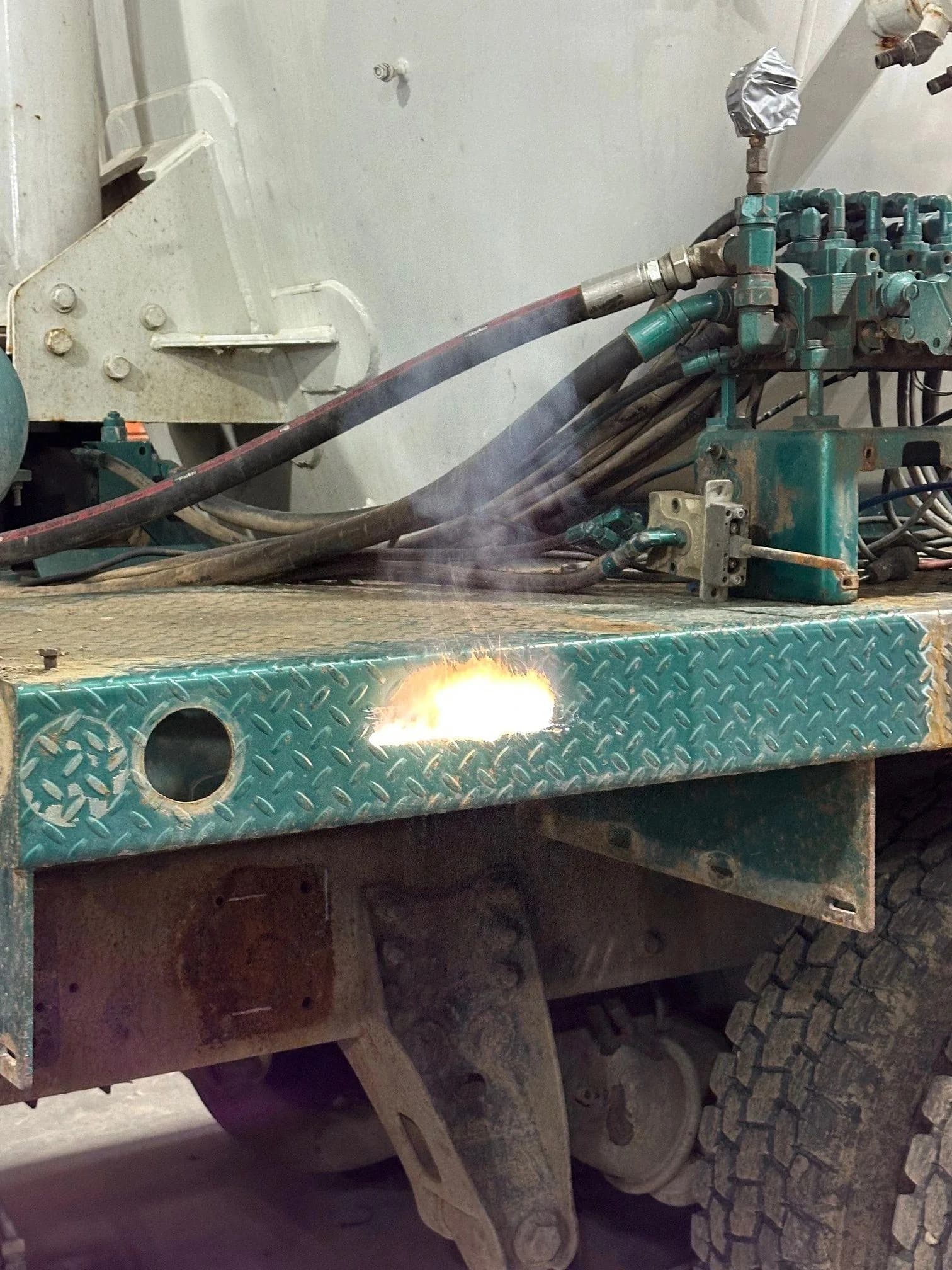Laser cleaning the underside of a trailer